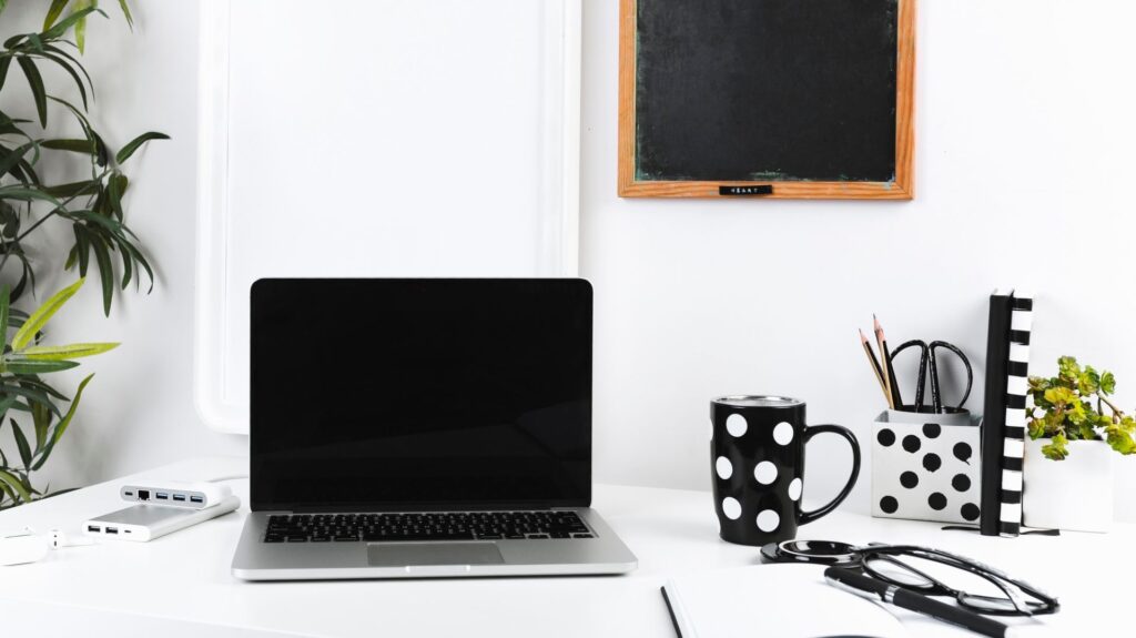 Minimalist luxury agency workspace with sleek digital interfaces, high-end abstract design features, and subtle dark blue lighting accents, introducing the corporate services suite.