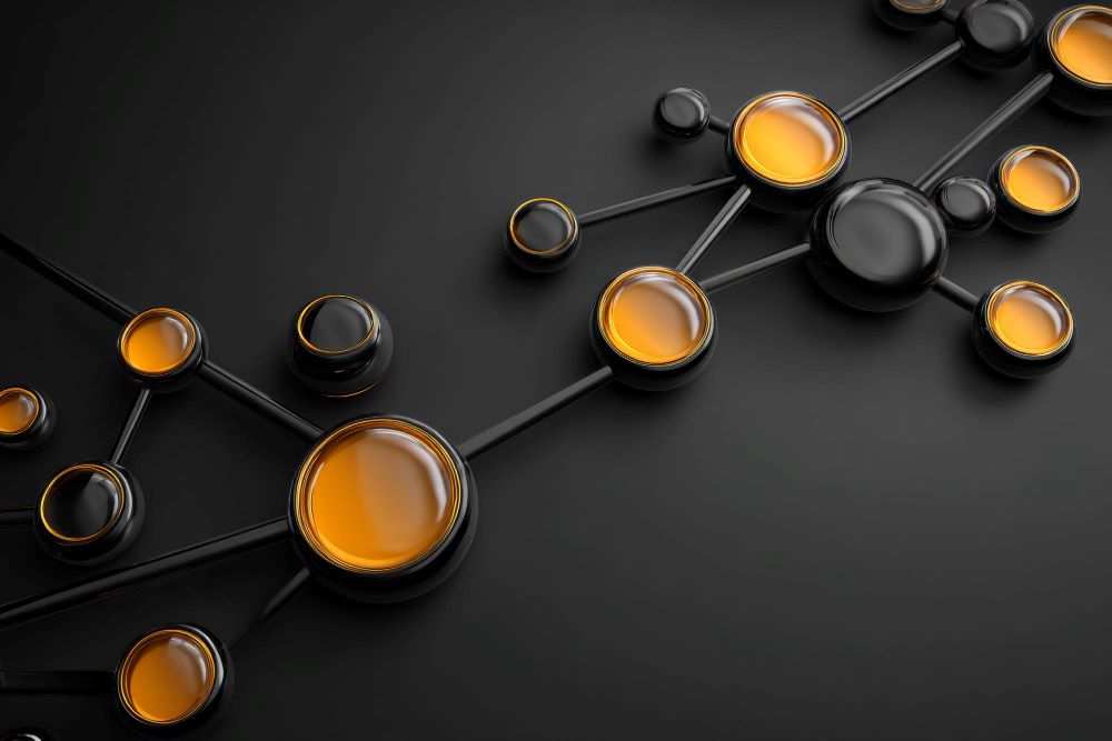 A 3D abstract digital network diagram showing interconnected glossy black and vibrant orange spherical nodes linked by solid black pipelines against a dark grey background.